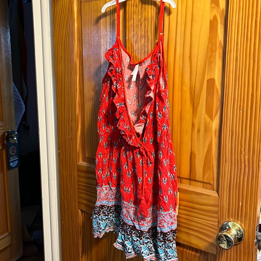 Size medium romper with button enclosure on top by Xhilaration